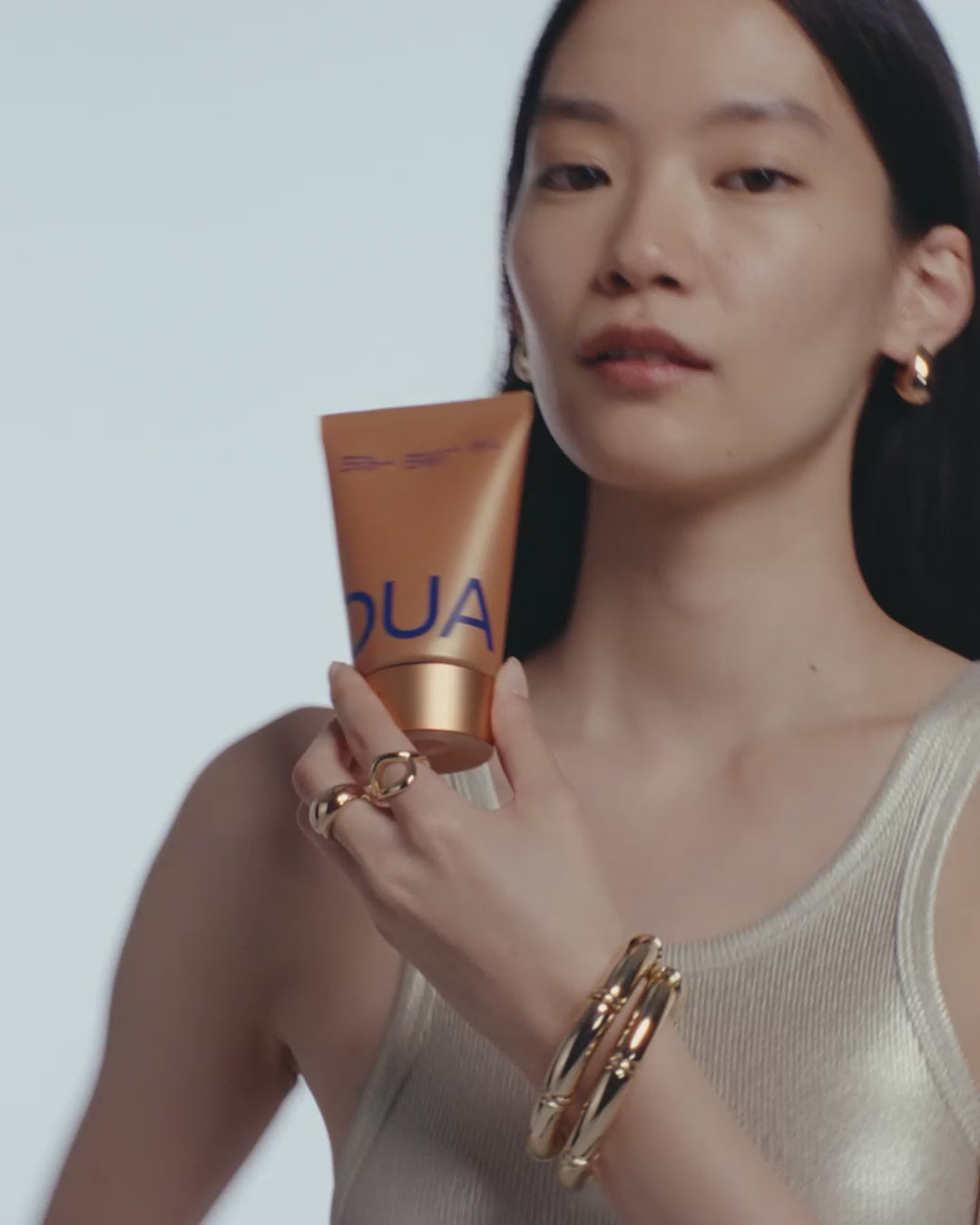 Male and female models showcase and apply all three skincare products